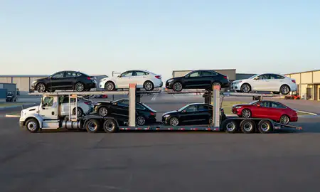 Car transporter parked in an industrial area of Lewistown, Montana, United States