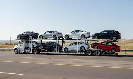Multi-level car carrier on the highway to Livingston, Montana, United States