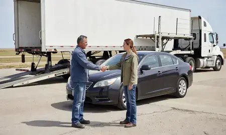 Vehicle owner beside their delivered car in Malmstrom AFB, Montana, United States