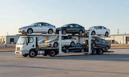 Car transporter loaded with vehicles in Miles City, Montana, United States