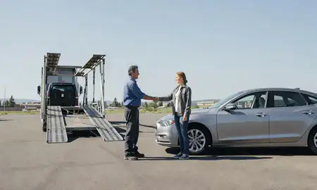 Vehicle owner beside their delivered car in Missoula, Montana, United States