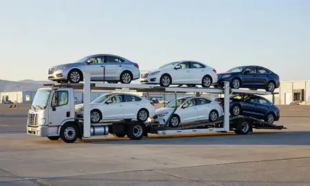 Car transporter loaded with vehicles in Missoula, Montana, United States