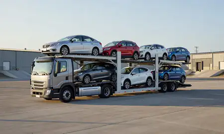 Car transporter loaded with vehicles in Orchard Homes, Montana, United States