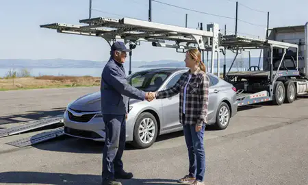 Vehicle owner beside their delivered car in Polson, Montana, United States