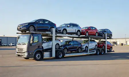 Car transporter loaded with vehicles in Sidney, Montana, United States