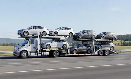 Multi-level car carrier on the highway to Whitefish, Montana, United States