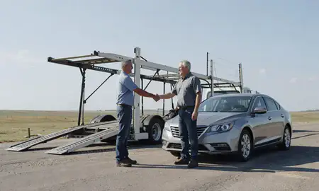 Vehicle owner beside their delivered car in Nebraska, United States