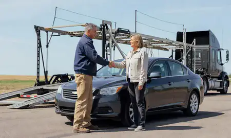 Vehicle owner beside their delivered car in Alliance, Nebraska, United States