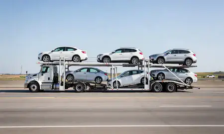 Multi-level car carrier on the highway to Beatrice, Nebraska, United States
