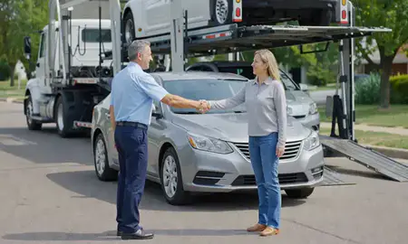 Vehicle owner beside their delivered car in Beatrice, Nebraska, United States