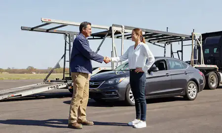 Vehicle owner beside their delivered car in Bellevue, Nebraska, United States