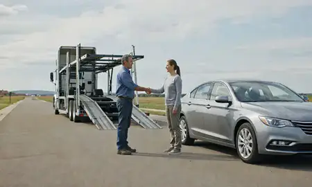 Vehicle owner beside their delivered car in Blair, Nebraska, United States