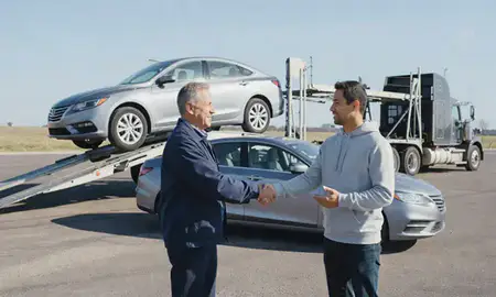 Vehicle owner beside their delivered car in Columbus, Nebraska, United States