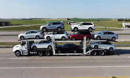 Multi-level car carrier on the highway to Fremont, Nebraska, United States