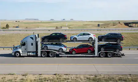 Multi-level car carrier on the highway to Gering, Nebraska, United States