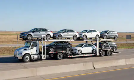 Multi-level car carrier on the highway to Grand Island, Nebraska, United States