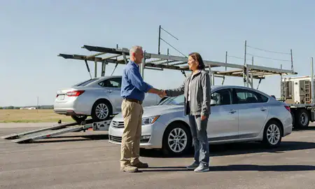 Vehicle owner beside their delivered car in Grand Island, Nebraska, United States