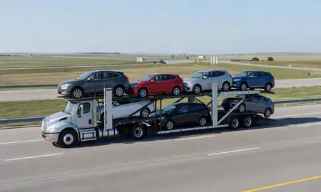Multi-level car carrier on the highway to Gretna, Nebraska, United States