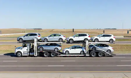 Multi-level car carrier on the highway to Lincoln, Nebraska, United States