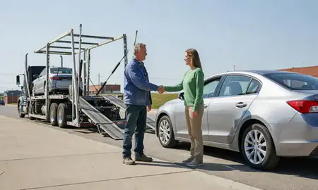 Vehicle owner beside their delivered car in Nebraska City, Nebraska, United States