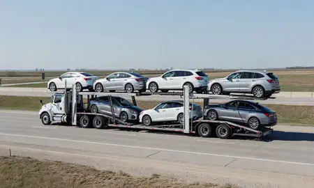 Multi-level car carrier on the highway to Norfolk, Nebraska, United States