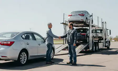 Vehicle owner beside their delivered car in Norfolk, Nebraska, United States