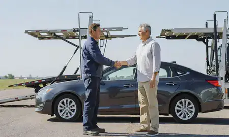 Vehicle owner beside their delivered car in North Platte, Nebraska, United States