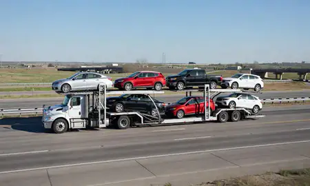 Multi-level car carrier on the highway to Omaha, Nebraska, United States