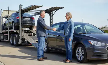 Vehicle owner beside their delivered car in Omaha, Nebraska, United States