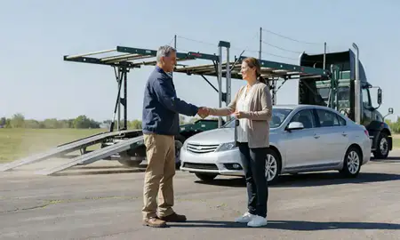 Vehicle owner beside their delivered car in Plattsmouth, Nebraska, United States