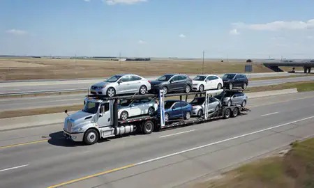 Multi-level car carrier on the highway to Schuyler, Nebraska, United States