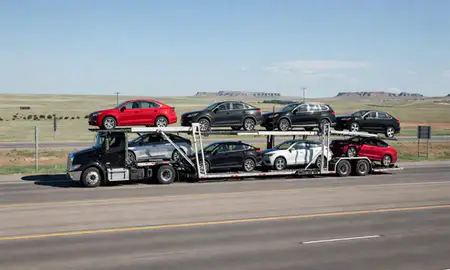 Multi-level car carrier on the highway to Scottsbluff, Nebraska, United States
