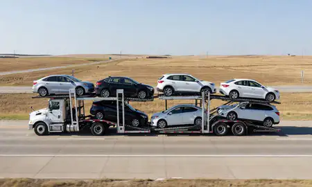 Multi-level car carrier on the highway to Sidney, Nebraska, United States