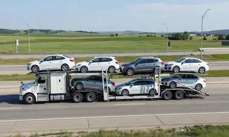 Multi-level car carrier on the highway to South Sioux City, Nebraska, United States
