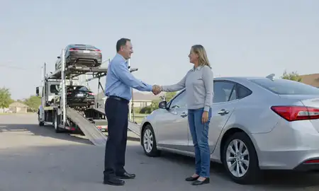 Vehicle owner beside their delivered car in York, Nebraska, United States