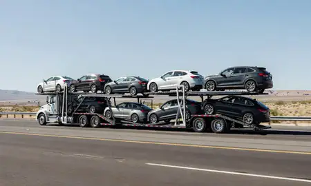 Multi-level car carrier on the highway to Boulder City, Nevada, United States