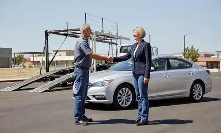 Vehicle owner beside their delivered car in Boulder City, Nevada, United States