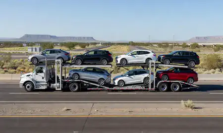 Multi-level car carrier on the highway to Dayton, Nevada, United States