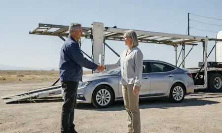 Vehicle owner beside their delivered car in Dayton, Nevada, United States
