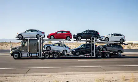 Multi-level car carrier on the highway to North Las Vegas, Nevada, United States