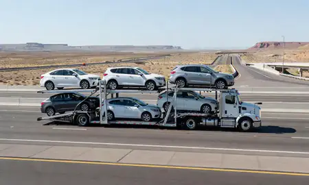 Multi-level car carrier on the highway to Pahrump, Nevada, United States