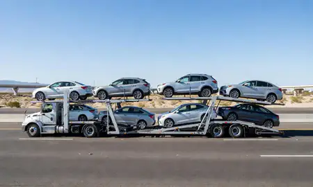 Multi-level car carrier on the highway to Paradise, Nevada, United States