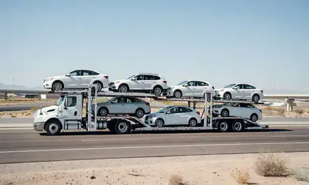 Multi-level car carrier on the highway to Summerlin South, Nevada, United States