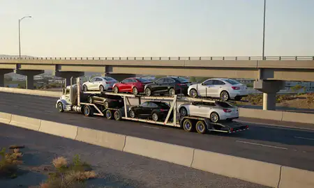 Car transporter with the Sun Valley, Nevada, United States skyline behind it