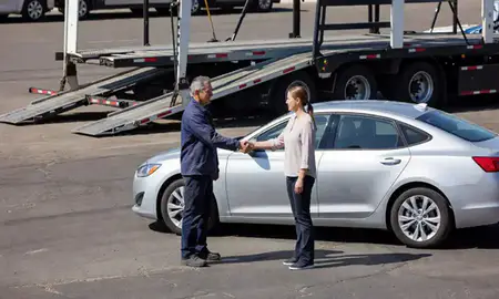 Vehicle owner beside their delivered car in Whitney, Nevada, United States