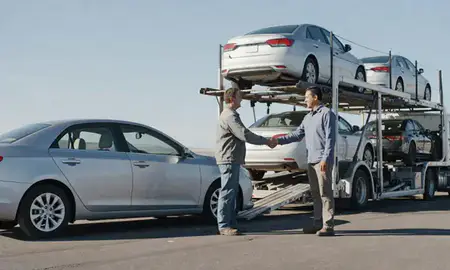 Vehicle owner beside their delivered car in Winnemucca, Nevada, United States