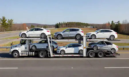 Multi-level car carrier on the highway to Center Ossipee, New Hampshire, United States