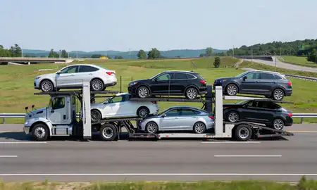 Multi-level car carrier on the highway to Contoocook, New Hampshire, United States