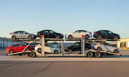 Car transporter parked in an industrial area of Contoocook, New Hampshire, United States
