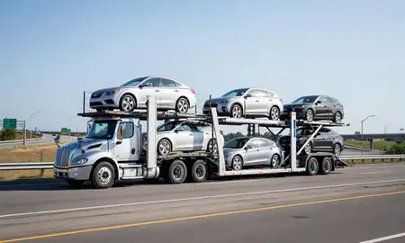Multi-level car carrier on the highway to Dover, New Hampshire, United States